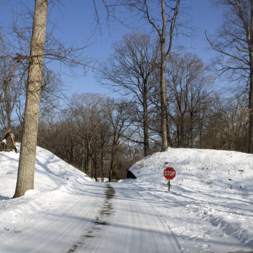Image of a trail at Fort Ancient Earthworks and Nature Preserve covered in snow.