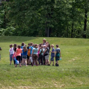 A ranger on tour with a group of visitors at Mound City Group. NPS / Tom Engberg