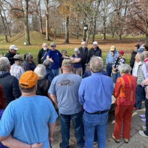 Archaeologist Brad Lepper giving a tour to a group of people at the Great Circle Earthworks.