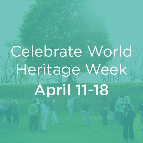 A tour takes a group of the Octagon Earthworks, overlayed with a blue background are the words 
